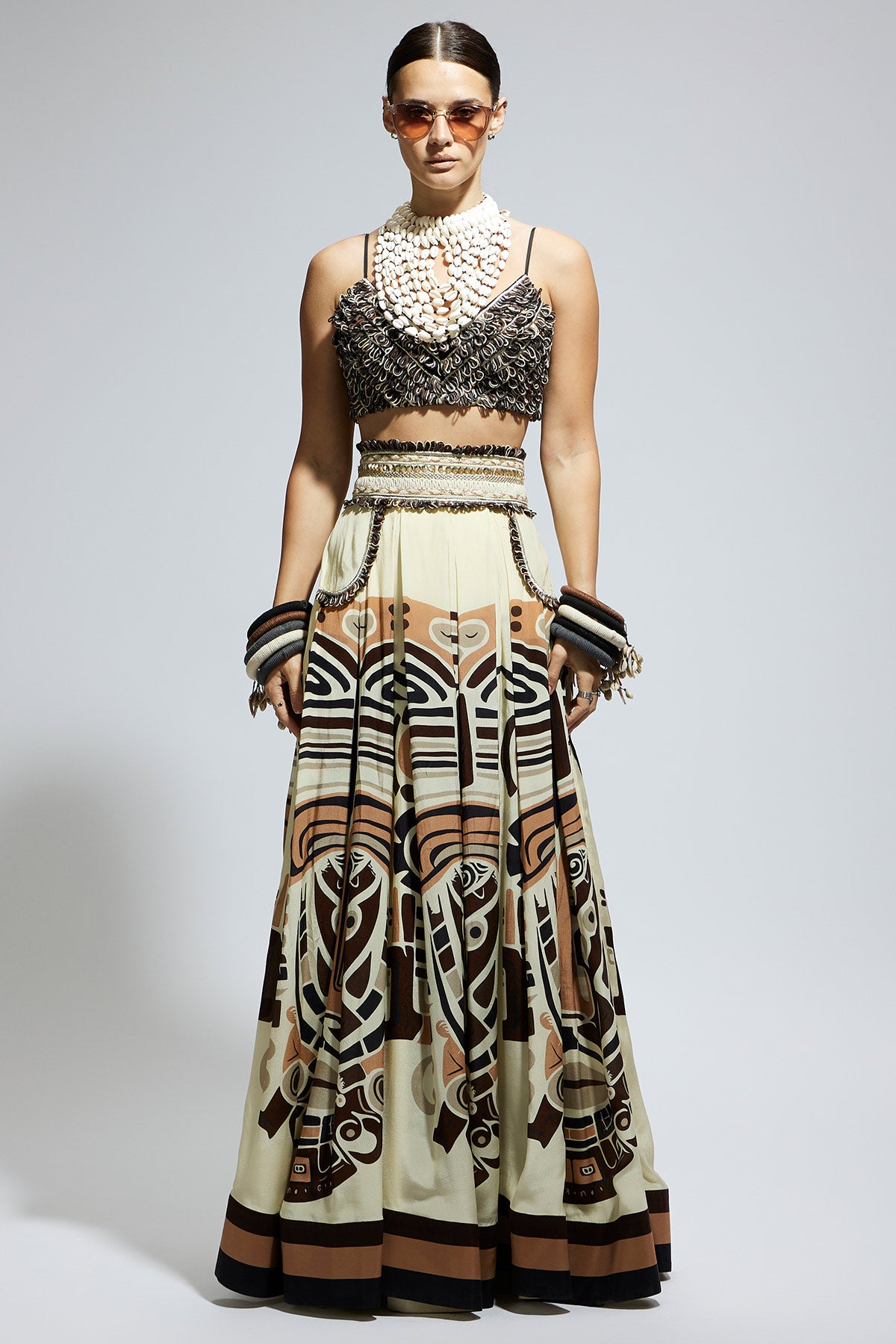 Ivory Mask Printed Box Pleated Skirt with Pockets Teamed with A Textured Bustier