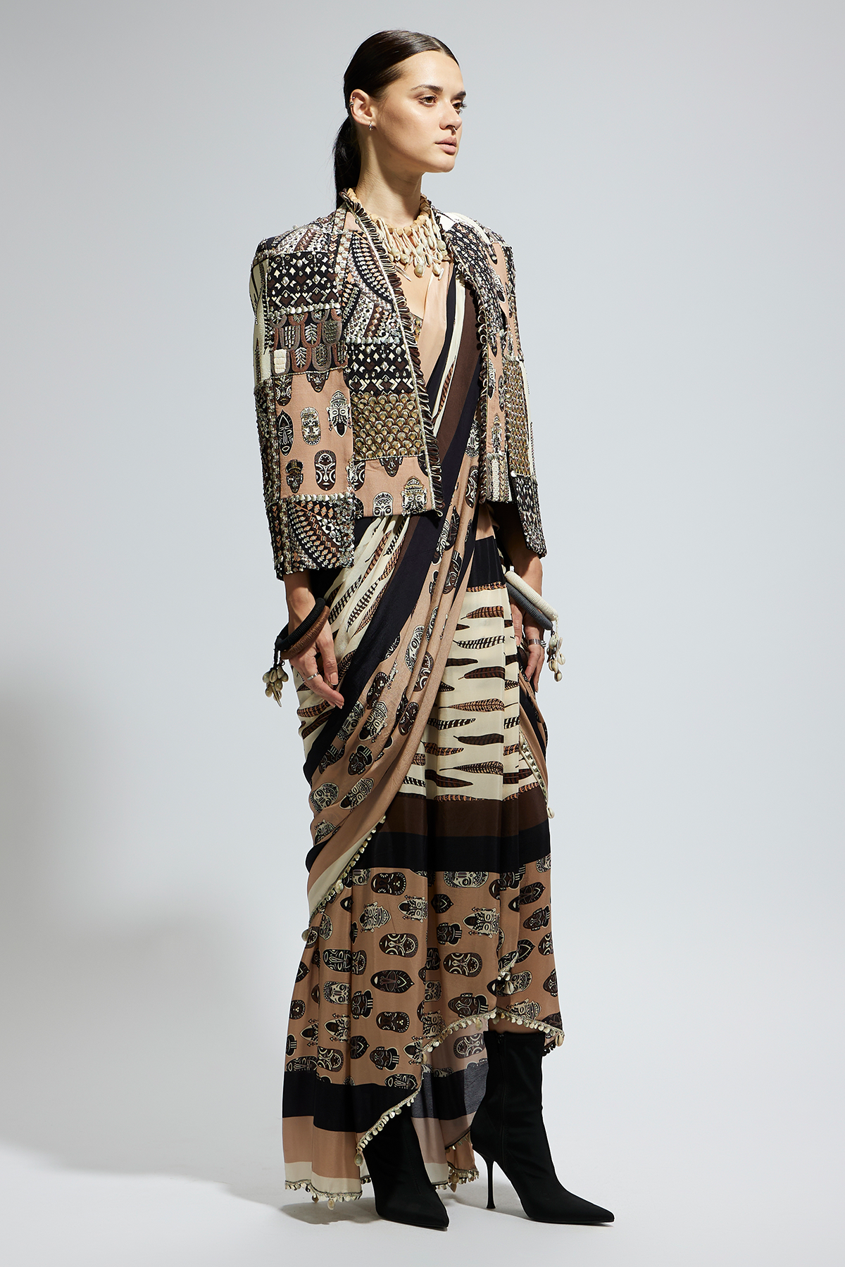 Mask and Feather Print Cascade Saree Paired with Metallic Scallop Bustier