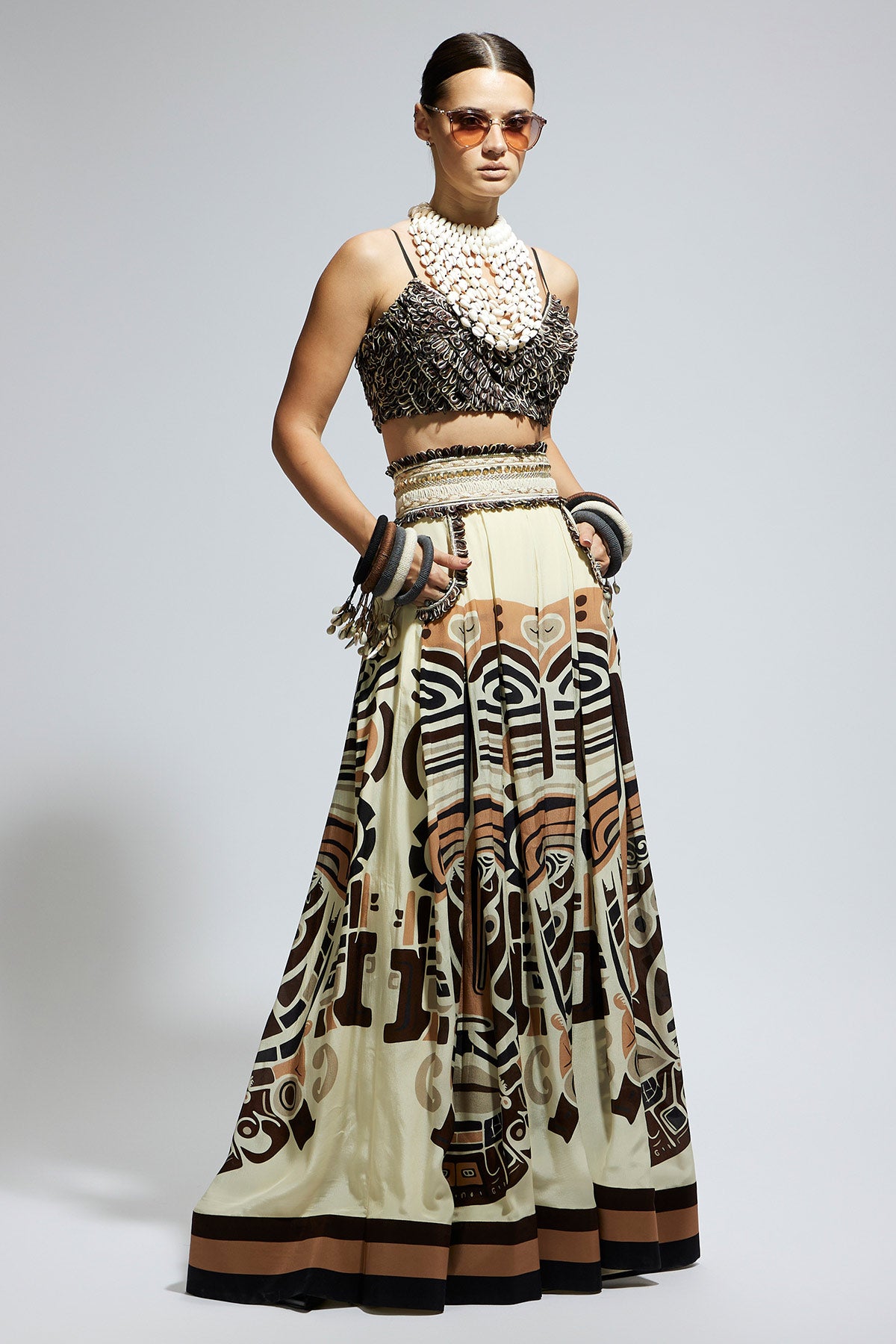 Ivory Mask Printed Box Pleated Skirt with Pockets Teamed with A Textured Bustier