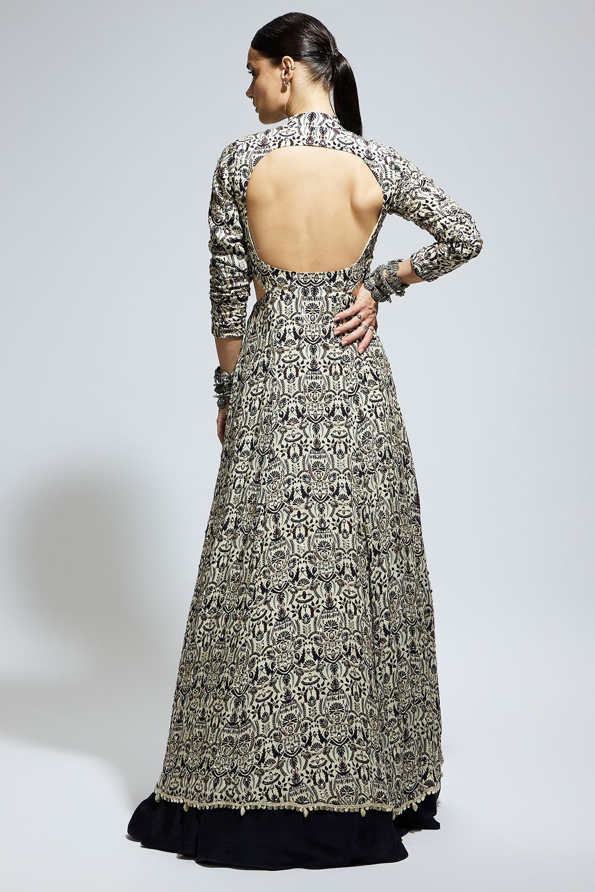 White Heavily Embellished Waist Cut out Jacket Paired a Midnight Blue Lehenga