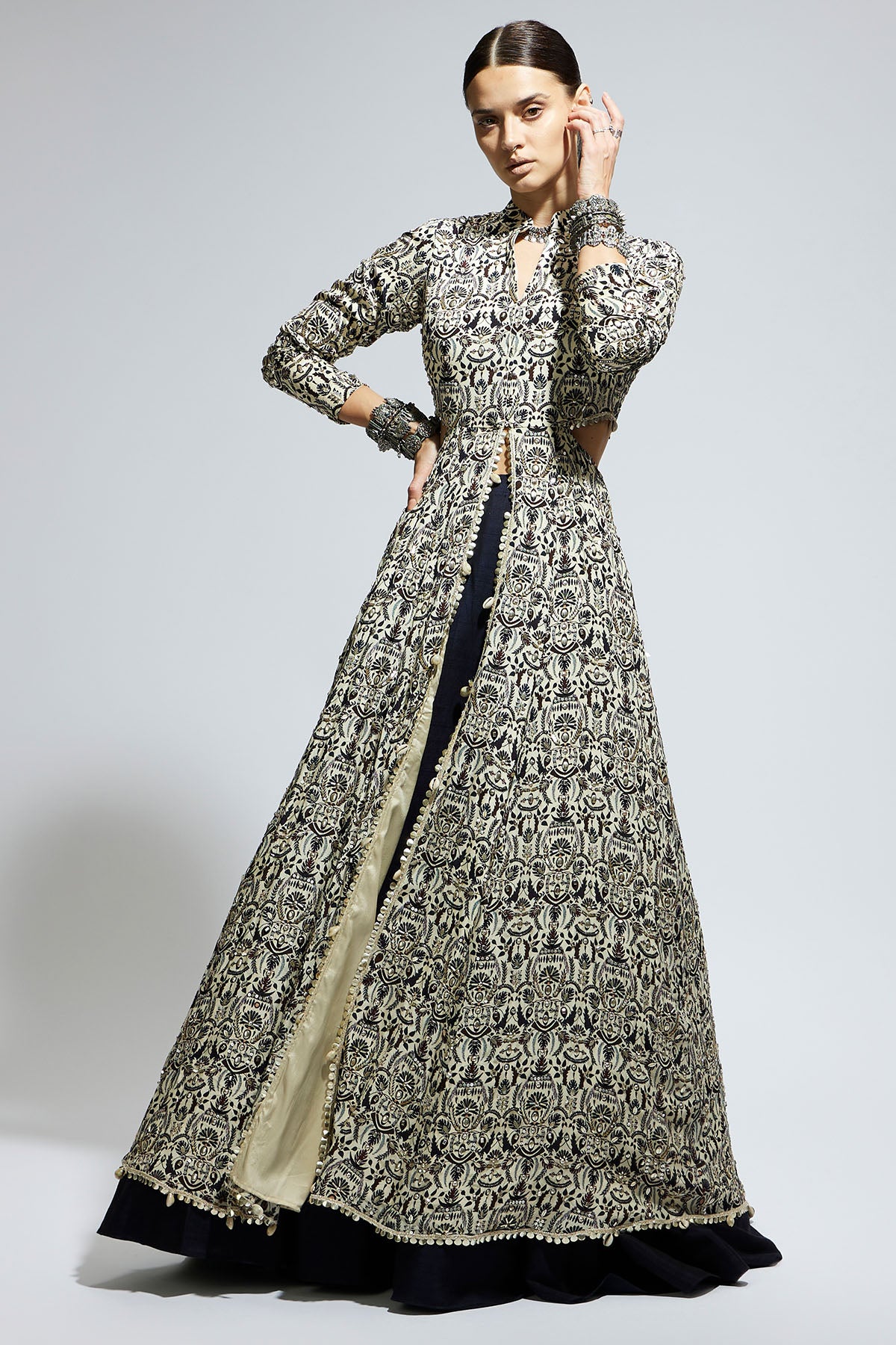 White Heavily Embellished Waist Cut out Jacket Paired a Midnight Blue Lehenga