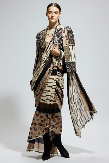 Mask and Feather Print Cascade Saree Paired with Metallic Scallop Bustier