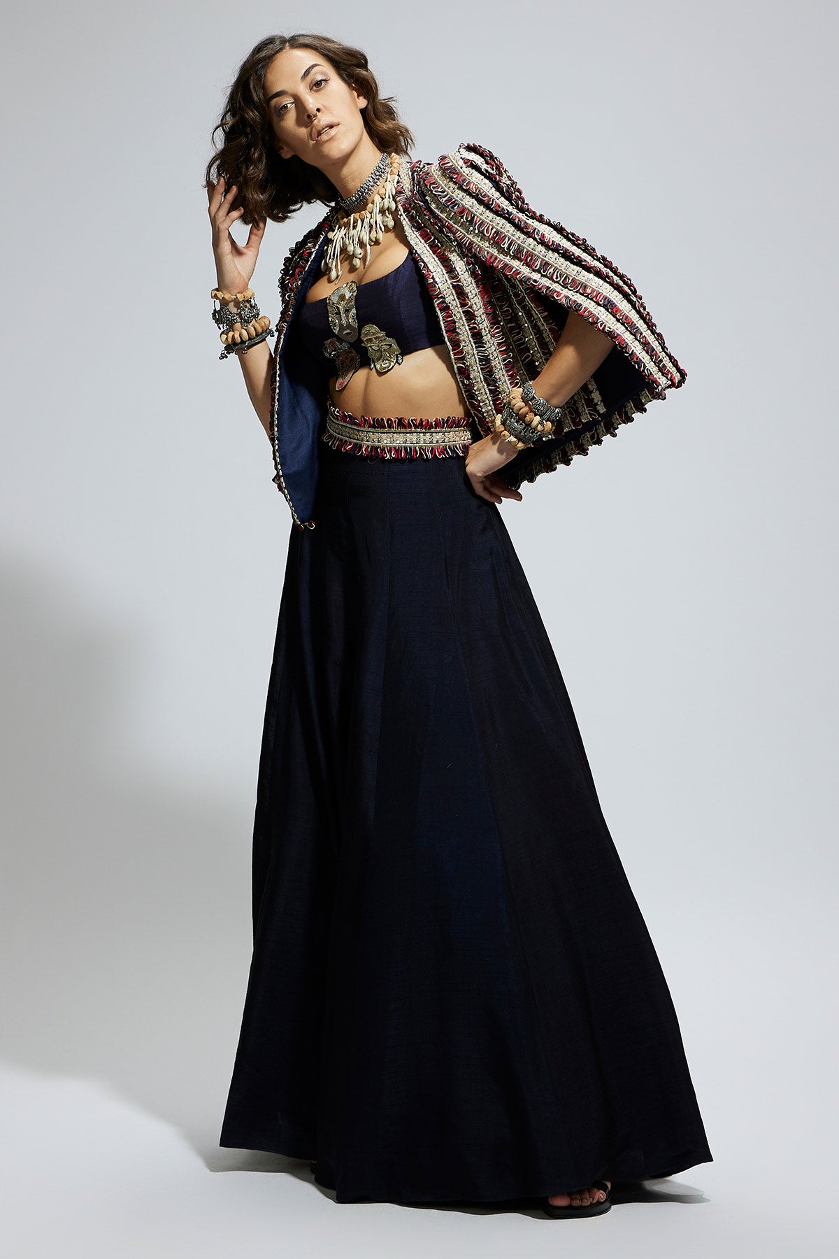 Blue Textured Embellished Cape Jacket Paired with Mask Applique Bustier and Lehenga