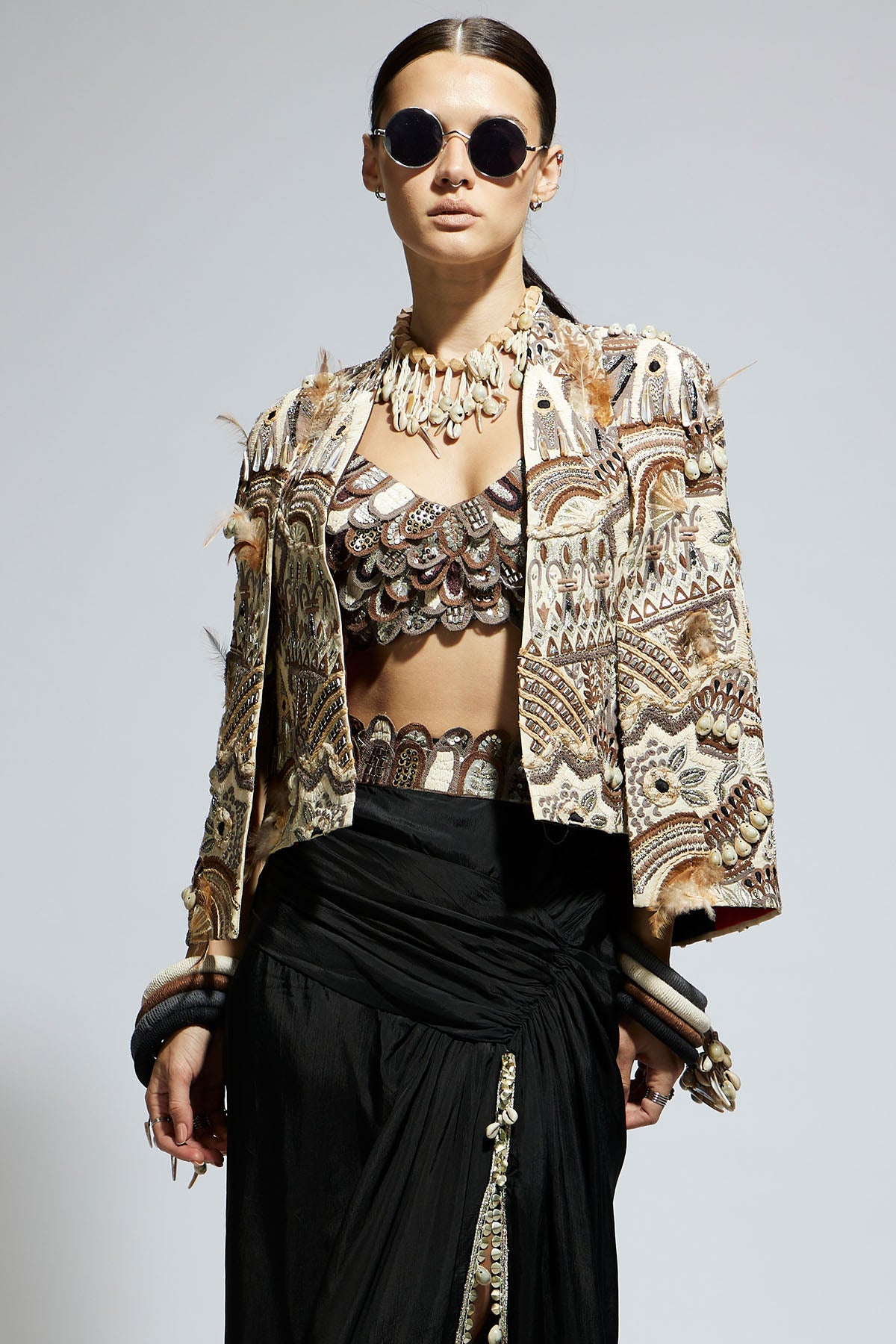 Ivory Abstract Feather Cape Jacket Paired with 3 D Scallop Bustier and Black High Slit Skirt