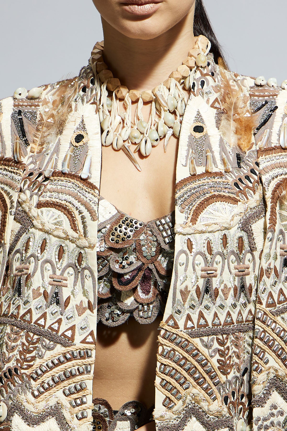 Ivory Abstract Feather Cape Jacket Paired with 3 D Scallop Bustier and Black High Slit Skirt