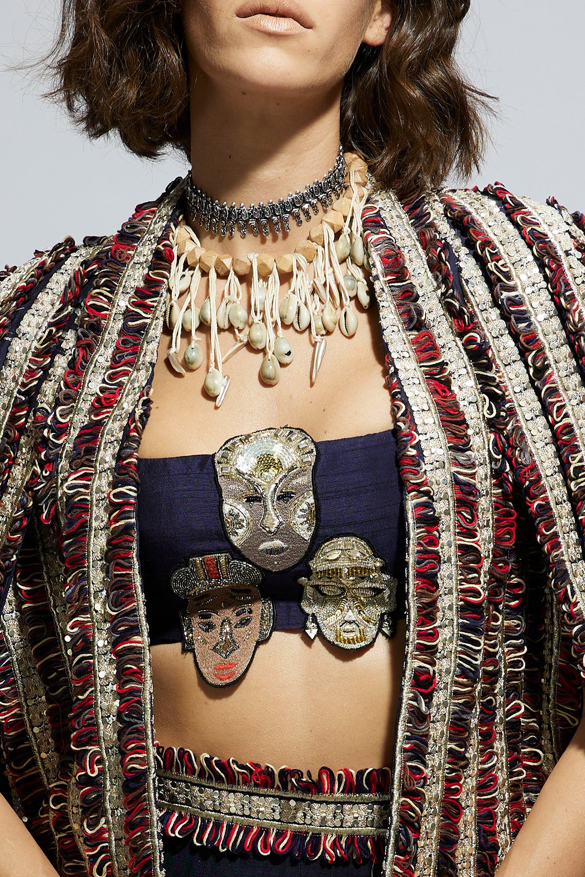 Blue Textured Embellished Cape Jacket Paired with Mask Applique Bustier and Lehenga