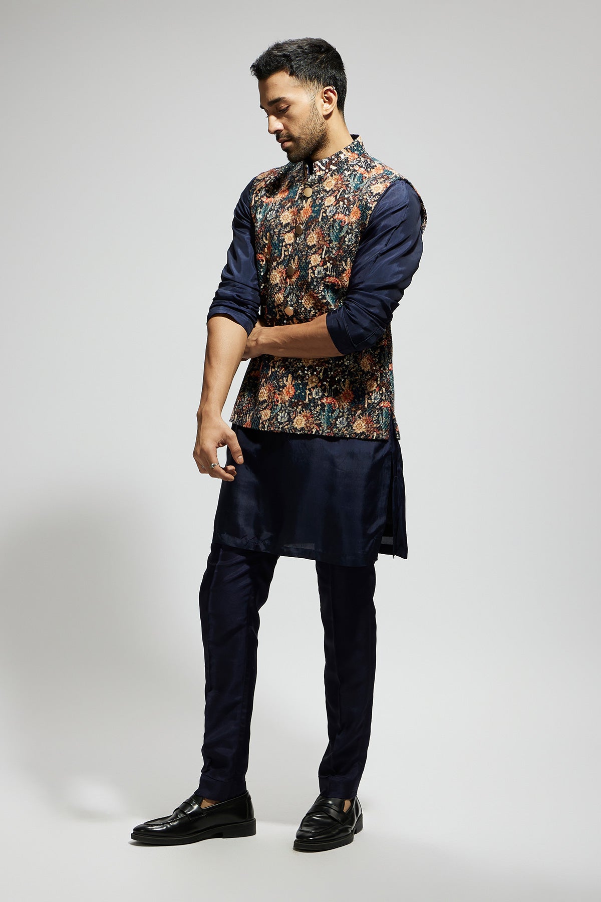 Blue Jaal Embellished Bundi Paired with Solid Blue Kurta and Pants